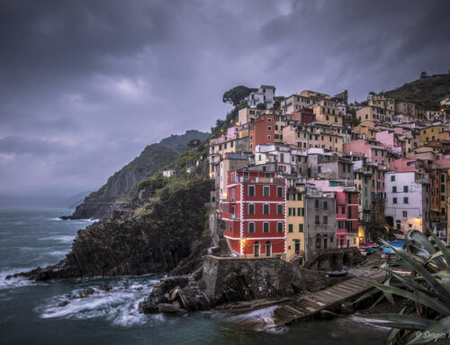 Riomaggiore: pastel-colored houses and the stormy sea